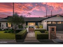 Charming home featuring manicured landscaping, brick mailbox, and inviting walkway at 4595 E Calle Redonda --, Phoenix, AZ 85018