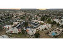 Aerial view of the condos, parking, landscape, and the surrounding neighborhood, showing a great location at 6009 N 79Th St, Scottsdale, AZ 85250