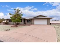 Charming single-story home with a two-car garage, well-kept yard, and a comfortable-sized driveway at 9703 W Forrester Dr, Sun City, AZ 85351