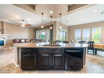 Open-concept kitchen with granite countertops and stainless steel appliances at 29412 N 128Th Ln, Peoria, AZ 85383