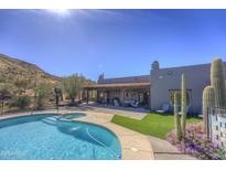 Beautiful pool and spa with desert landscaping, set against the backdrop of serene mountain views at 40445 N 32Nd St, Cave Creek, AZ 85331