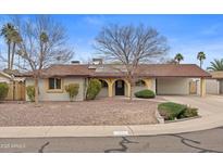 Charming single-story home with desert landscaping and a covered carport at 11431 N 37Th Pl, Phoenix, AZ 85028