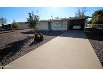 Charming single-story home with desert landscaping and a covered carport in a quiet neighborhood at 120 N 54Th St, Mesa, AZ 85205