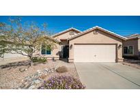 Charming single-story home featuring desert landscaping and a two-car garage at 24431 N 35Th Dr, Glendale, AZ 85310