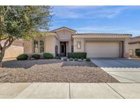 Charming single-story home featuring a well-maintained yard and neutral color palette at 4221 E Sourwood Dr, Gilbert, AZ 85298