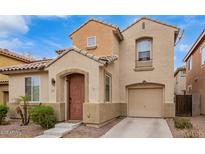 Charming two-story home with a private entrance, arched entry and an attached single car garage at 7840 W Bonitos Dr, Phoenix, AZ 85035