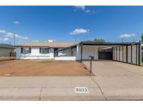 Charming single-story home with carport and white exterior at 9033 N 15Th Dr, Phoenix, AZ 85021