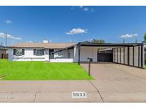 Charming single-story home with well-maintained lawn, carport, and desirable curb appeal at 9033 N 15Th Dr, Phoenix, AZ 85021