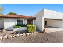 Charming single-story home with a red-tile roof, inviting entrance, and a two-car carport at 100 N Lazy Fox Rd # 3, Wickenburg, AZ 85390