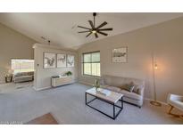 Inviting living room features neutral tones, vaulted ceilings and an abundance of natural light at 13641 W Solano Dr, Litchfield Park, AZ 85340