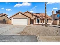 Charming single-story home featuring a two-car garage and low maintenance desert landscaping at 15764 W Shiloh Ave, Goodyear, AZ 85338