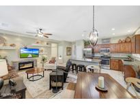 Open living space combining kitchen, dining, and living areas for seamless entertaining at 20462 N Ridgewood Ln, Surprise, AZ 85374