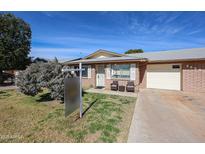 Charming single-story home with a well-maintained lawn and inviting front porch at 9602 W Ironwood Dr # A, Peoria, AZ 85345