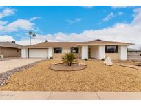 Charming single story home featuring a 2-car garage, desert landscaping, and a welcoming covered entry at 13110 W Blue Bonnet Dr, Sun City West, AZ 85375