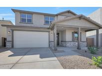 Charming two-story home featuring a covered porch, stone accents and a two car garage at 4069 W Nora Dr, San Tan Valley, AZ 85144