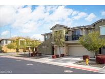 Beautiful two-story townhome with a balcony, two car garage, and lovely desert landscaping at 5100 E Rancho Paloma Dr # 2024, Cave Creek, AZ 85331