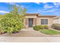 Charming single-story home featuring stone accents, low maintenance desert landscaping, and a mature lemon tree at 5206 W Desert Hills Dr, Glendale, AZ 85304