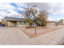 Cozy single-story home featuring a low-maintenance desert landscape and covered parking at 904 W Tulane Dr, Tempe, AZ 85283