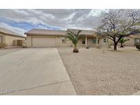 Charming single story home with low maintenance landscaping, long driveway, and tile roof at 14545 S Cherry Hills Dr, Arizona City, AZ 85123