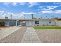 Charming single-story home featuring desert landscaping, a walkway, and freshly painted exterior at 2205 W Cambridge Ave, Phoenix, AZ 85009