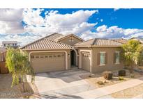 Charming single-story home featuring a three-car garage and well-maintained landscaping at 24478 N 166Th Ave, Surprise, AZ 85387