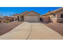 Charming single-story home with a two-car garage and low-maintenance desert landscaping at 25797 W St Charles Ct, Buckeye, AZ 85326