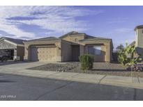 Charming single-story home with desert landscaping and attached two-car garage at 3864 W Fairway Dr, Eloy, AZ 85131