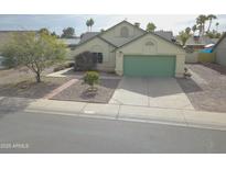 Charming single-Gathering home showcasing a well-manicured front yard and a two-car garage at 655 W Mission Dr, Chandler, AZ 85225