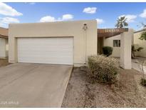 Charming single-story home with a two-car garage, and a well-maintained front yard at 11609 N 30Th Ln, Phoenix, AZ 85029