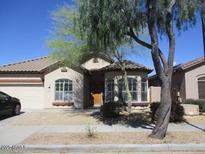 Charming single-story home featuring desert landscaping, a two car garage and a covered entry at 32020 N 23Rd Ave, Phoenix, AZ 85085