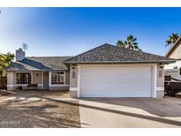 Charming one-story home with a two car garage, landscaped front yard and mature trees at 4813 W Milky Way, Chandler, AZ 85226
