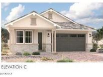 Charming single-story home with stone accents, gray garage door, and manicured landscaping at 5359 W Las Palmaritas Dr, Glendale, AZ 85302