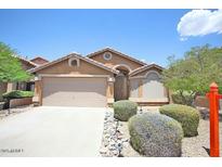 Charming single-story home with desert landscaping and a two-car garage at 10226 E Pine Valley Rd, Scottsdale, AZ 85255