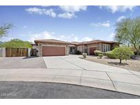 Charming single-story home featuring a tile roof, brick accents, and a three-car garage at 4116 E Sierra Sunset Trl, Cave Creek, AZ 85331