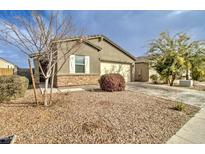 Charming single-story home showcasing desert landscaping and attached two-car garage at 4240 W Crossflower Ave, San Tan Valley, AZ 85144