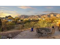 Enjoy this patio with mountain views in the background, perfect for outdoor dining or relaxing under the desert sun at 10322 E Breathless Ave, Gold Canyon, AZ 85118