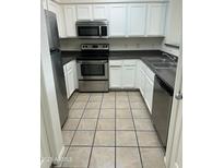 Bright kitchen with stainless steel appliances and white cabinetry at 20100 N 78Th Pl # 1007, Scottsdale, AZ 85255