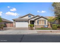 Charming single-Gathering home with a well-manicured lawn and a two car garage at 20742 E Mockingbird Dr, Queen Creek, AZ 85142