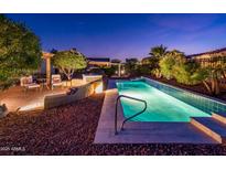 Exterior image featuring a private pool, desert landscaping, and a stone patio at 23236 N Caleta Ct, Sun City West, AZ 85375