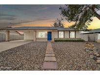 Charming single-story home featuring a well-manicured landscape and a lovely walkway to the front door at 4229 W Aster Dr, Phoenix, AZ 85029