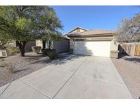 Charming single-story home with a well-maintained front yard and two car garage at 4514 W Ellis St, Laveen, AZ 85339