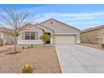 Charming single-story home featuring desert landscaping, neutral stucco, and attached two-car garage at 4718 E Pearl Rd, San Tan Valley, AZ 85143