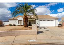 Charming single-story home featuring desert landscaping and a two-car garage at 10216 W Minnezona Ave, Phoenix, AZ 85037