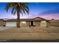 Charming single-story home with brick accents, solar panels and a well-manicured desert landscape at 12806 W Jadestone Dr, Sun City West, AZ 85375