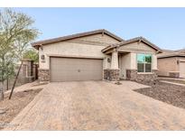 Charming single Gathering home featuring a two car garage and paver driveway at 256 N Jesse St, Chandler, AZ 85225