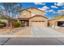 Two-story home featuring a well-manicured yard, covered porch, and a two car garage at 32 W Desert Vista Trl, San Tan Valley, AZ 85143