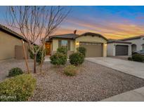 Charming single-story home with manicured front yard and desert landscaping and a two car garage at 4143 E Appaloosa Rd, Gilbert, AZ 85296