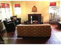 Inviting living room features a decorative fireplace, tile flooring, and comfortable seating at 525 W Cypress St, Phoenix, AZ 85003