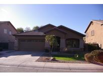 Charming single-story home featuring a tile roof, desert landscaping, and a two-car garage at 1083 E Jade Dr, Chandler, AZ 85286