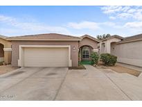 Charming single-story home showcasing a well-kept exterior and a two-car garage at 15203 N 28Th Pl, Phoenix, AZ 85032